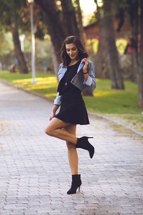 little black dress with denim jacket and black stiletto ankle boots