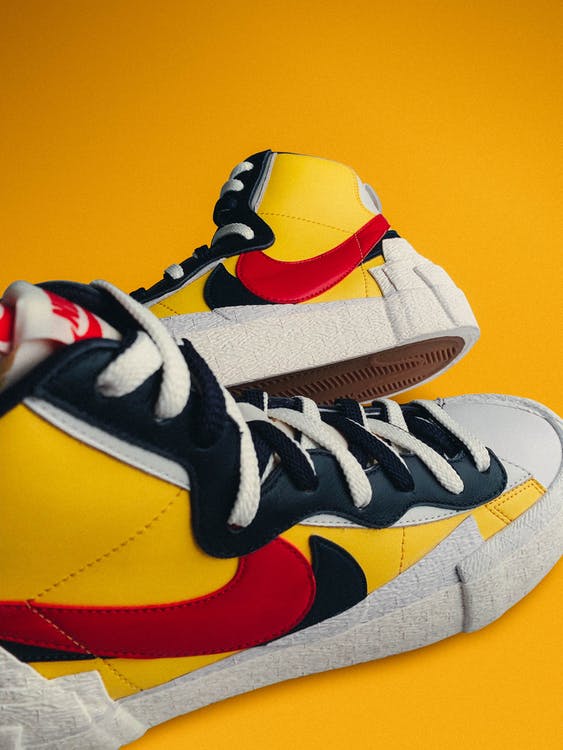 yellow red and black high top Nike sneakers